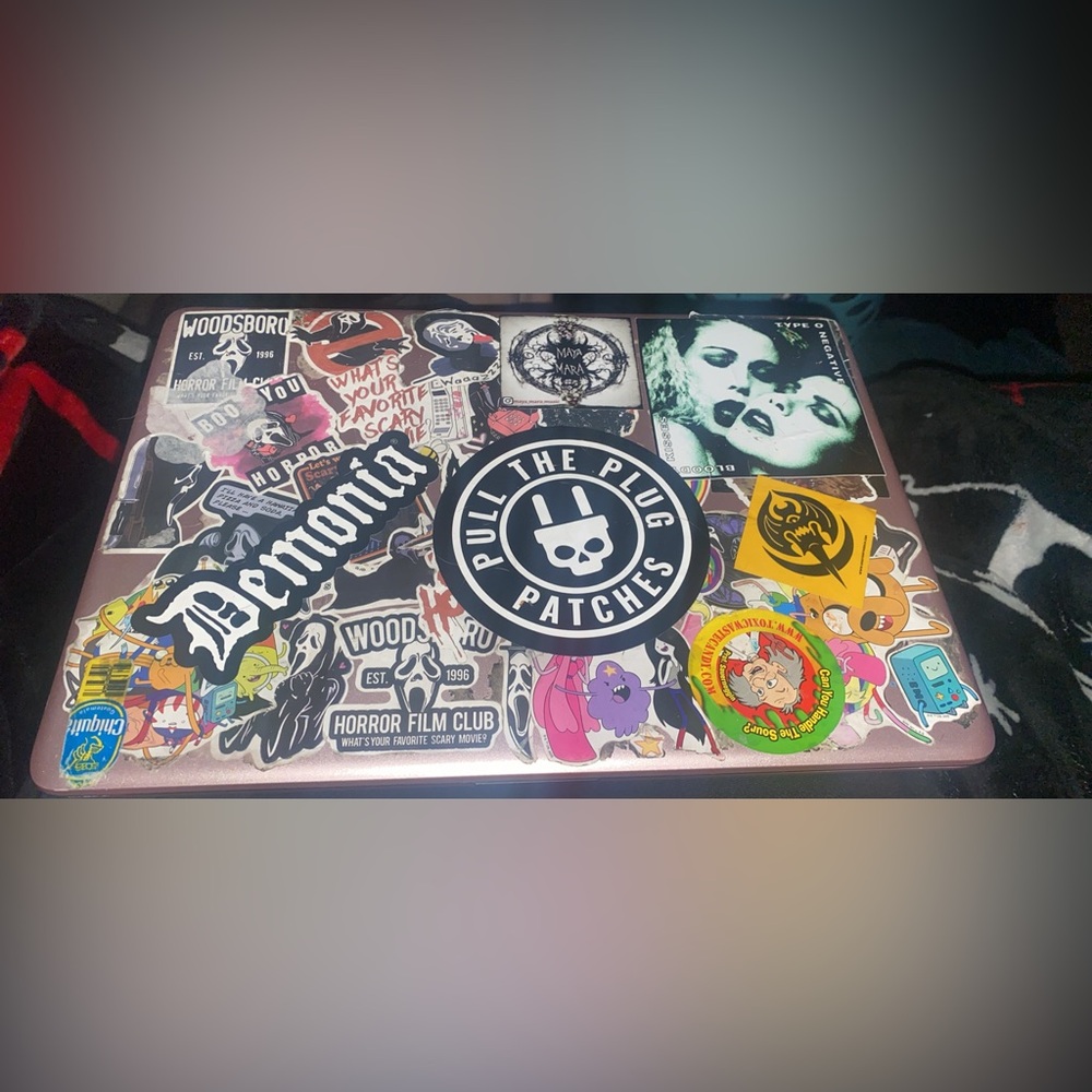 HP Pink Laptop with Assorted Sticker-Covered Lid